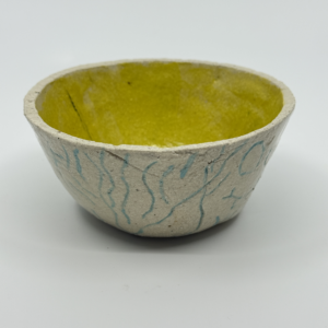 Glazed bowl with yellow and blue  patterns