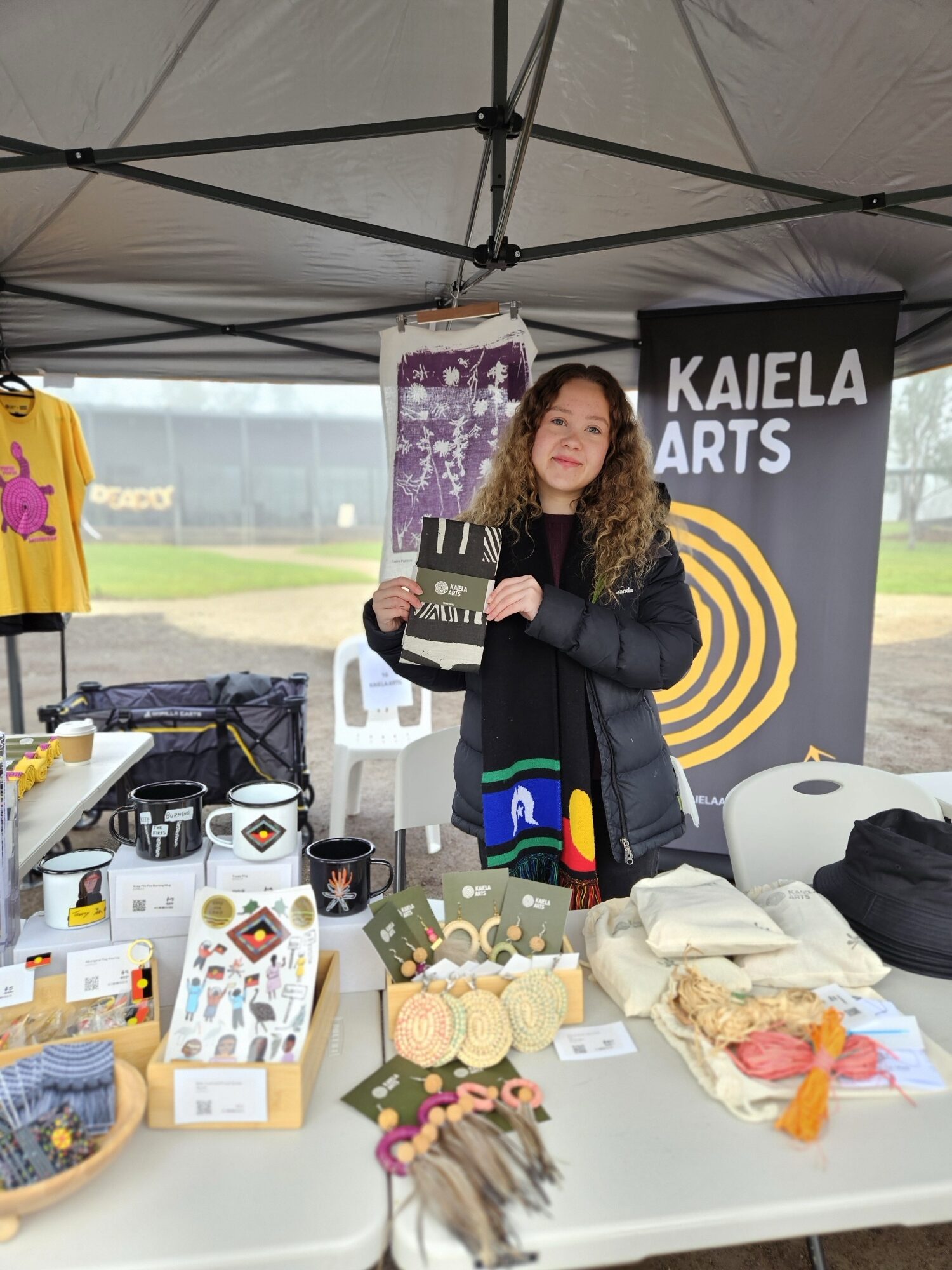 Mya Falla at the Kaiela Arts market stall