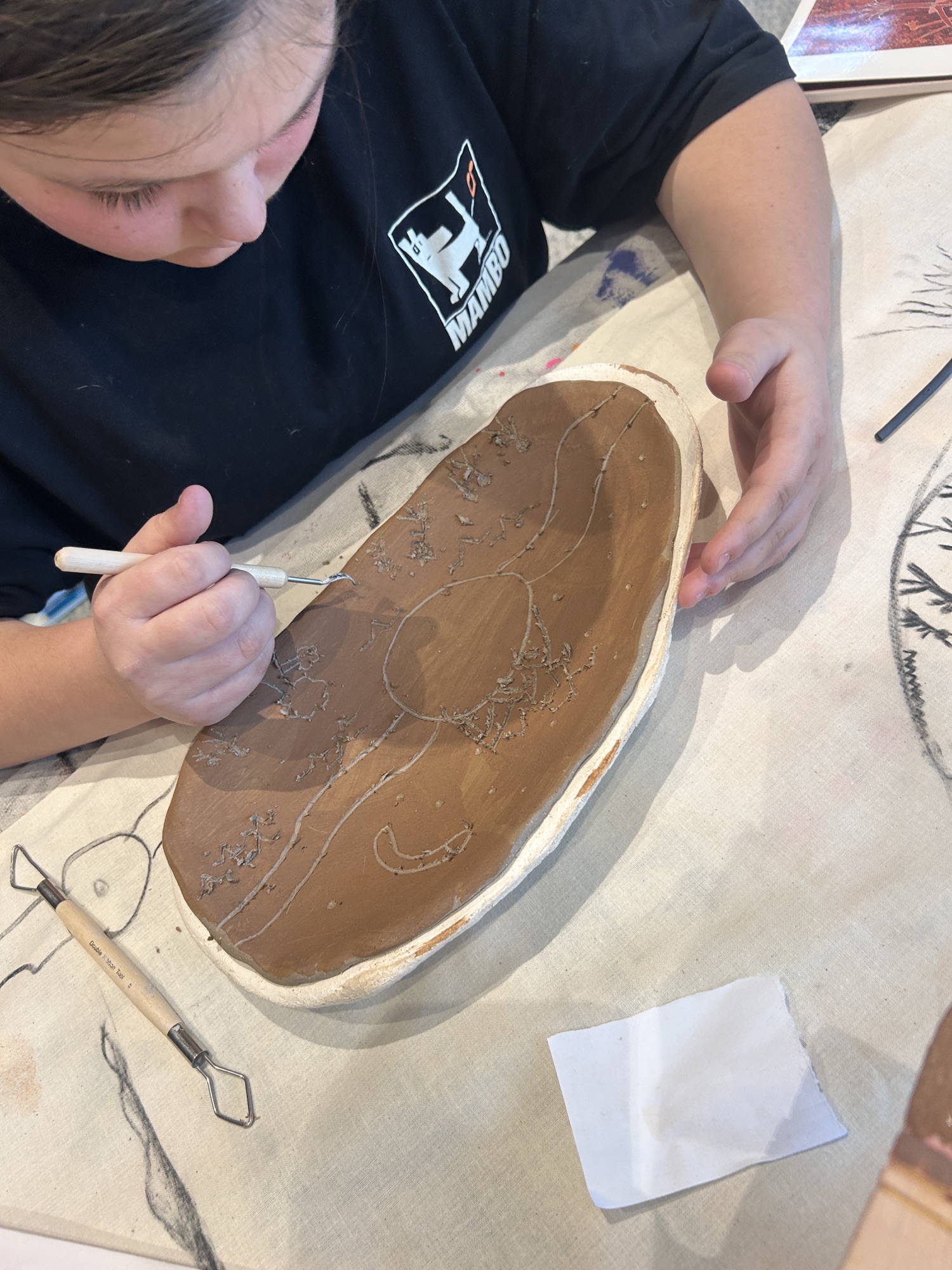 Galnyatj participant decorating a coolamon