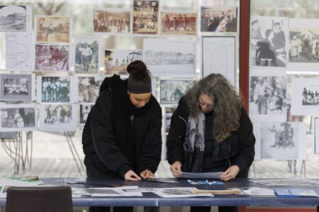 Family history photographs on display at a KINnected Camp, 2024