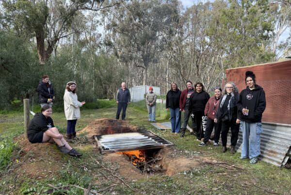 Students and staff from Shepparton Flexible Learning Centre with Kaiela Arts staff and artists at the pit firing